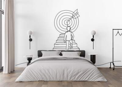 Drawing of businessman climbing stairs toward large target. One line style art Wall mural