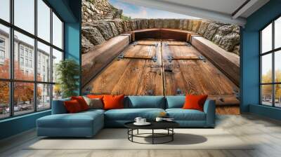 A large wooden door swings open within the rock castle wall. Wall mural