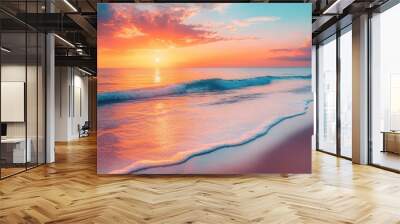 A serene beach at sunset with gentle waves washing up on the shore. The sky is painted with warm hues of orange and pink Wall mural