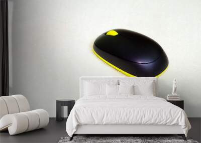 wireless black and yellow colored computer mouse isolated on white cloth Wall mural