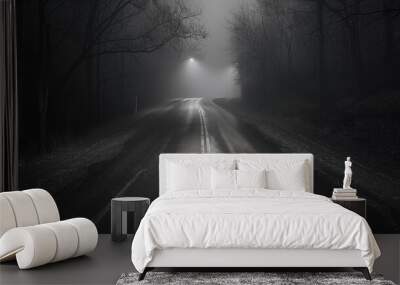 Empty, foggy road illuminated by streetlights, winding through a dark and eerie forest, creating a mysterious and haunting atmosphere. Wall mural