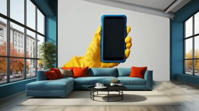 A hand in yellow clothes holds a black screen, a mobile phone is highlighted on a white background with a blue case, Generative AI Wall mural