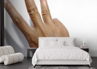 hands raised three finger in white background Wall mural