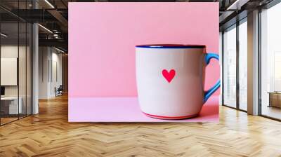 red and blue heart on the side of ceramic coffee cup isolated on pastel Wall mural