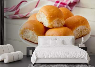 Soft bread rolls on white plate Wall mural