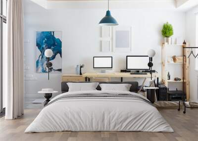 Beautiful cozy modern bright interior furniture made of natural materials and a workplace with two computers and monitors with a white screen. Home goods concept. Advertising space Wall mural