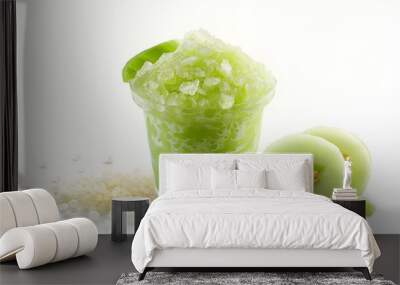 Green slush in a cup with tapioca pearls, next to sliced honeydew and melon balls. Wall mural