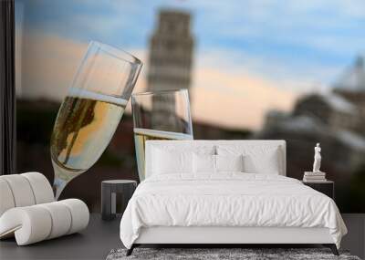 two glasses of champagne with the tower of pisa in the backgroun Wall mural