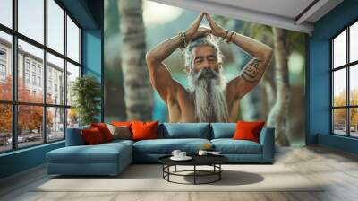 A 50-year-old man with gray beard and hair, fit body, practicing yoga outdoors for a healthy lifestyle. Wall mural