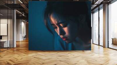 An emotional depiction of a woman in a state of depression, emphasizing feelings of sadness, loneliness, and despair Wall mural