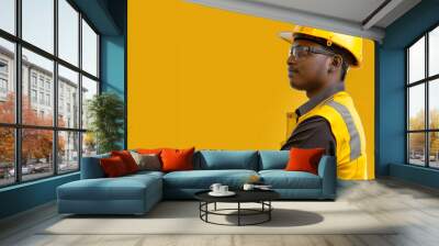 portrait of a worker on yellow background Wall mural