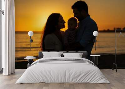 Silhouettes of a Family at Sunset on the Beach Wall mural