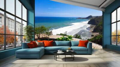 Surumanis beach, a beautiful blue beach with black sand and surrounded by hills Wall mural