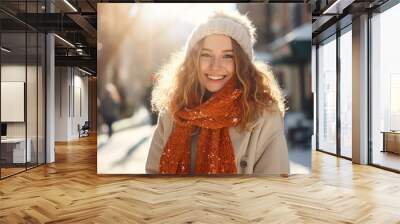 happy smiling portrait of a woman in city winter Wall mural