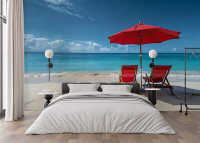 Two red beach chairs and an umbrella on a beautiful white sand beach Wall mural