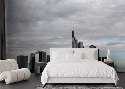 Cityscape with skyscrapers and cloudy sky Wall mural