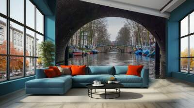 A bridge over the narrow canals of Amsterdam in Holland Wall mural