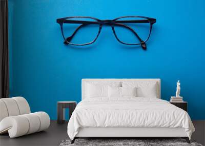 graduated glasses on blue background Wall mural