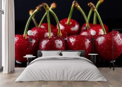 a group of red cherries with water drops on them with black background Wall mural