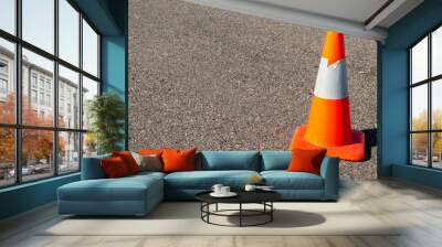 Orange safety cone on asphalt Wall mural