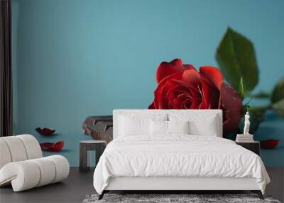 Beautiful red rose and dark chocolate for valentine day on blue background Wall mural