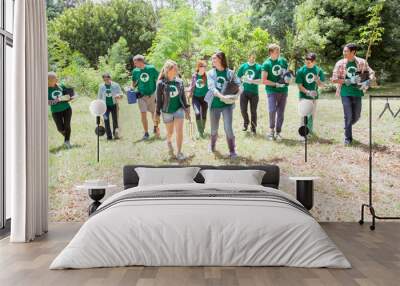 Environmentalist volunteers planting new tree Wall mural