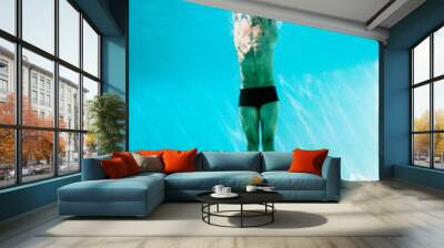 Man underwater in swimming pool Wall mural