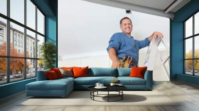 Man working on ceiling lights Wall mural