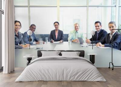 Portrait of confident business people at table in conference room Wall mural