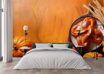 delicious homemade pumpkin cinnamon knots pastry on rustic background Wall mural