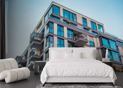 modern corner apartment complex with blue colored windows and light leaks Wall mural