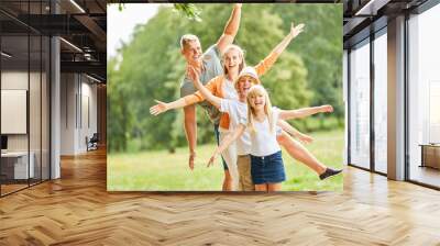 Active family and children have fun together Wall mural