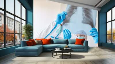 Doctors with x-ray of pneumonia Wall mural