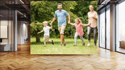 Family with two kids together in summer Wall mural