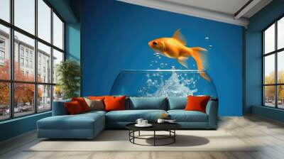 Goldfish jumping out of round fishbowl into freedom Wall mural