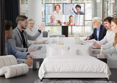 Group of business people in video conference at meeting Wall mural