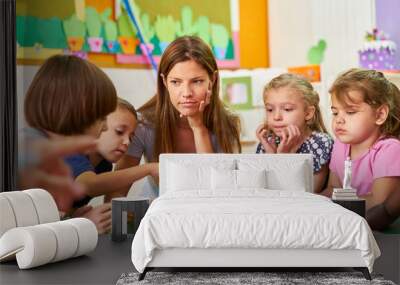 Group of children and carer read a children's book Wall mural