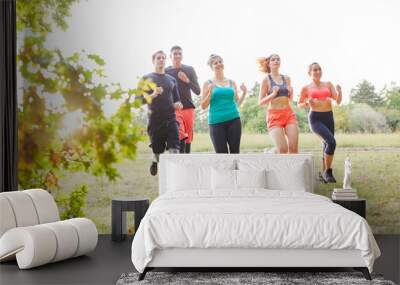 Group of friends trains endurance and fitness Wall mural