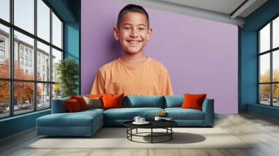 Happy Hispanic boy with a big smile on a purple background Wall mural