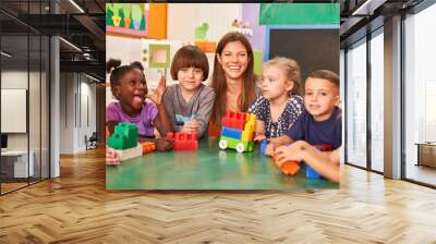 Happy kids in preschool or kindergarten Wall mural