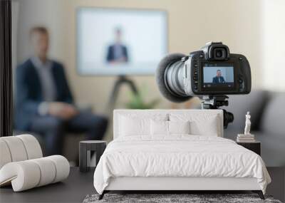 Professional video camera recording an interview with blurred background Wall mural