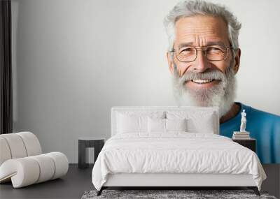 Mature, bearded man with a cheerful smile wearing a blue sweatshirt stands alone on a white background, looking at the camera. Mid-aged, gray-haired senior hipster with Generative AI tech Wall mural