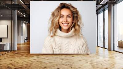 Portrait of a beautiful young woman with long blond hair in a white sweater Wall mural