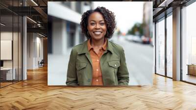 portrait of smiling african american businesswoman in urban street Wall mural