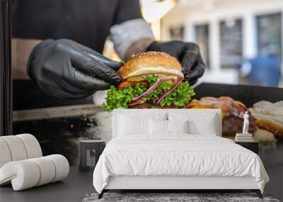 Preparing of fresh burger with potato fries chips on grill Wall mural