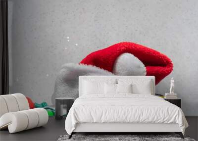 Santa Hat with Colored String Lights isolated against Snowy Sparkly Backdrop Wall mural