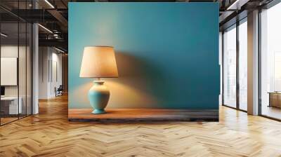 Table lamp on wooden table with space on blue wall background Wall mural