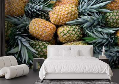 Stack of freshly harvested ripe raw pineapples in Costa Rica, Central America Wall mural