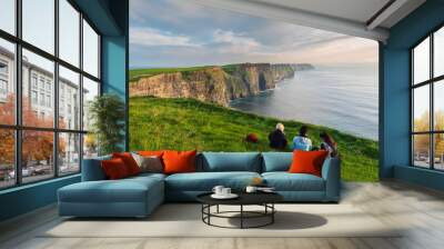 Girls sitting near the edge of the cliffs of Moher  Wall mural