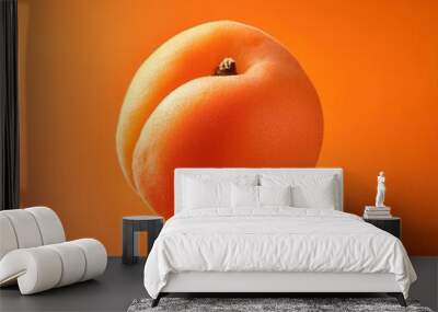 apricot isolated on orange background, square food photography Wall mural